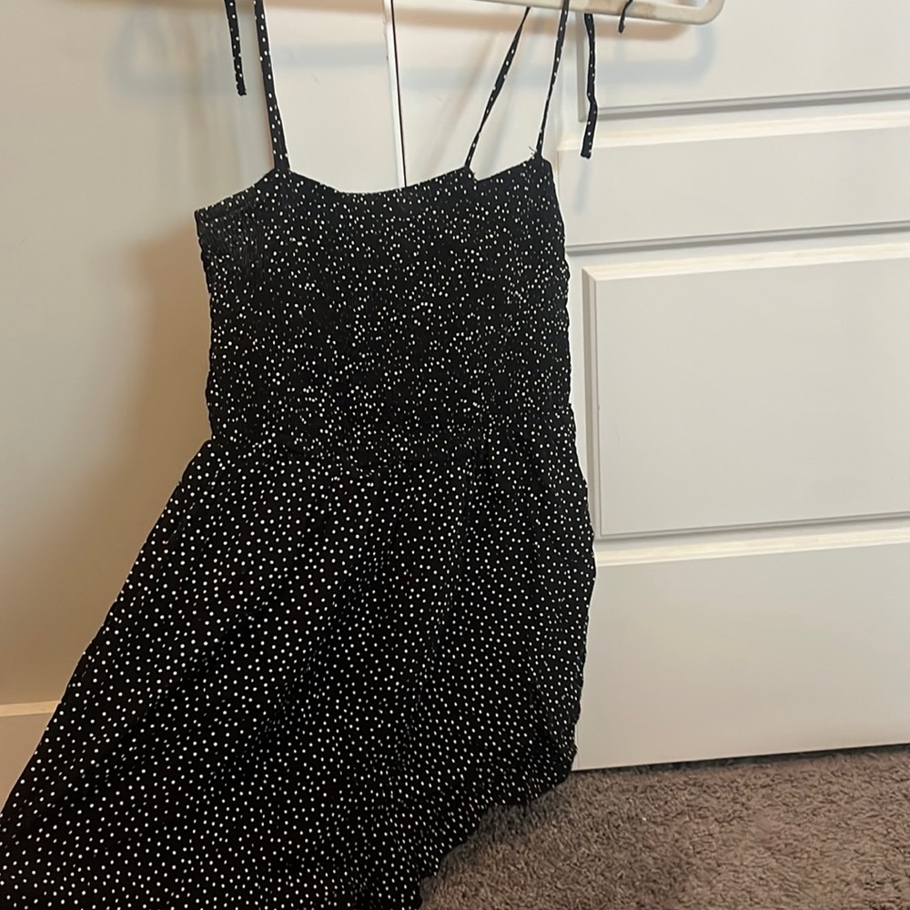 Black and polka dot white romper